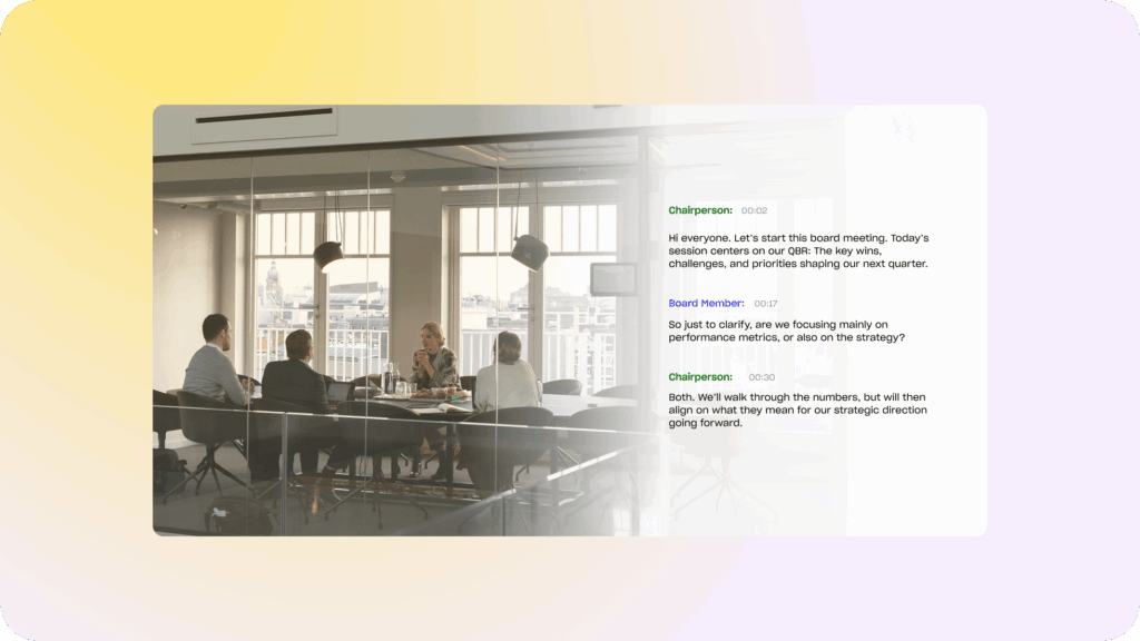 multiple professionals sitting in a conference room while someone is transcribing on their computer 