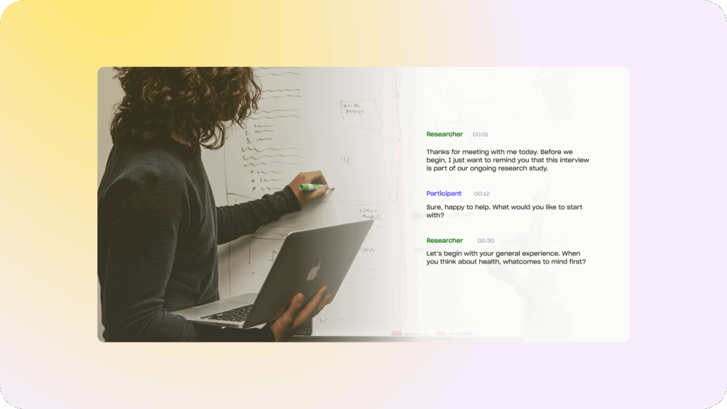 Researcher at a whiteboard reviewing an interview transcript